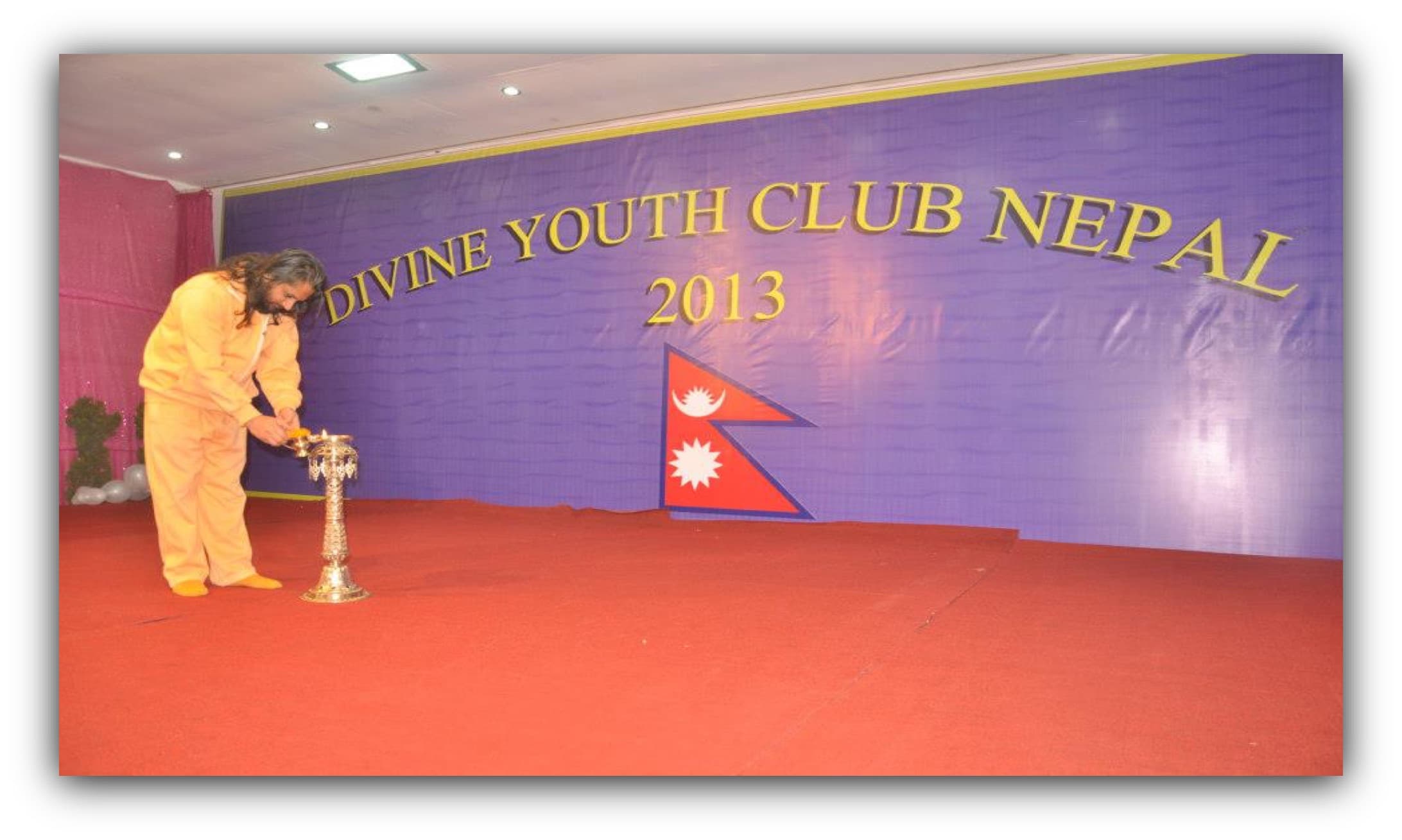 Swami Shree Haridasji lighting the inaugural lamp at Divine Youth Club Nepal's 2013 founding ceremony